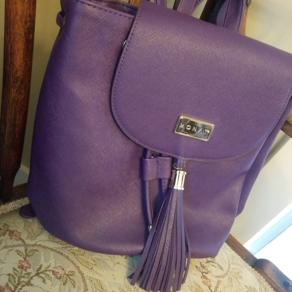 monat Handbags - Nwot purple backpack